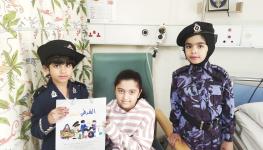 الشرطي الصغير يزور الأطفال المنومين بمستشفى جامعة السلطان قابوس1.jpg