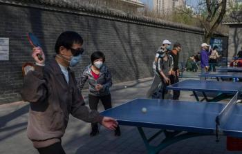 الصين تعلن رفع قيود التنقل عن  معقل كورونا.jpg